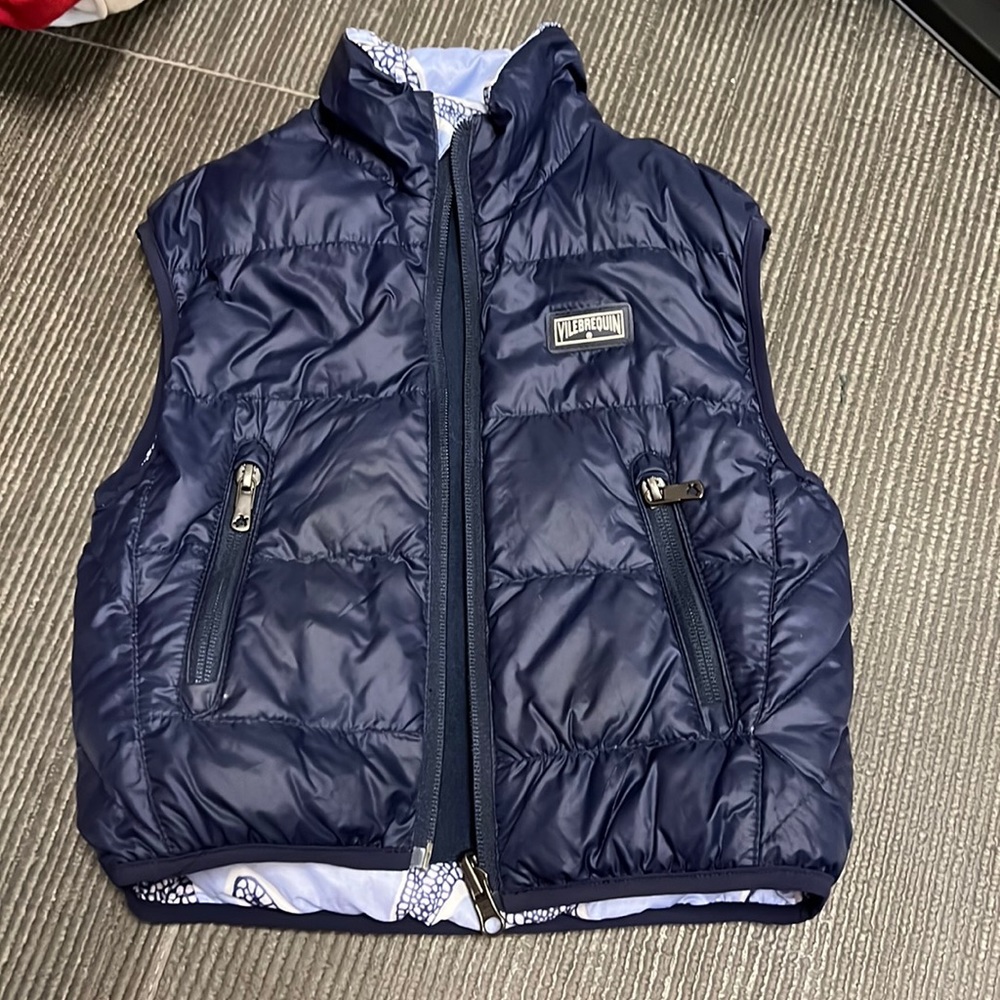 Double sided vilebrequin vest with feathers inside